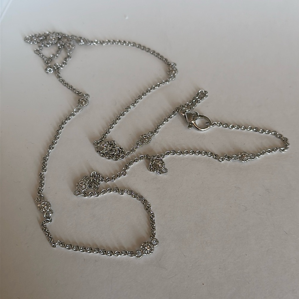 Judith Ripka 925 Sterling chain with cz flower detail.